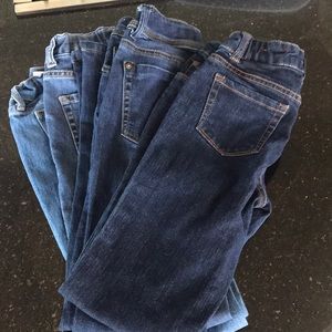 Four pairs of girls jeans.